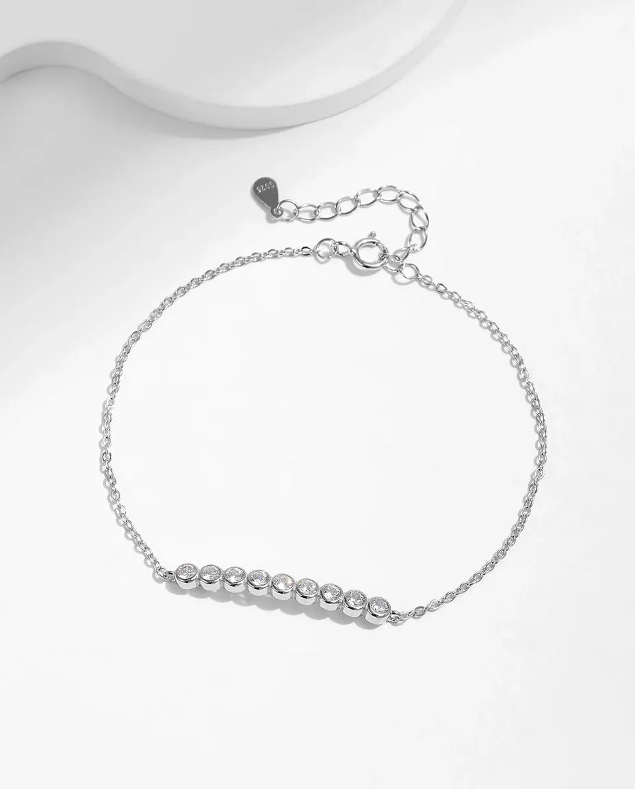 Dainty moissanite station bracelet, 9 round D colour stones, 925 sterling silver
