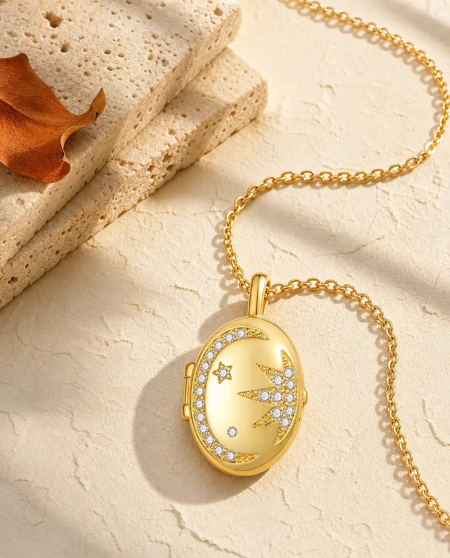 Personalised moon and star oval photo locket necklace holding two pictures, gold