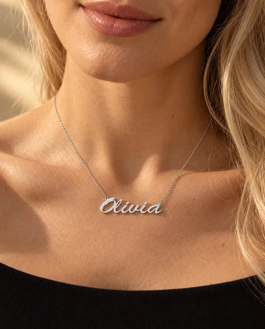 Personalised Brush Script Name Necklace in 925 Sterling Silver - Custom Nameplate - worn on a model