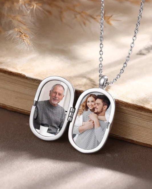 Open men's photo locket necklace showing two custom pictures inside the oval frames