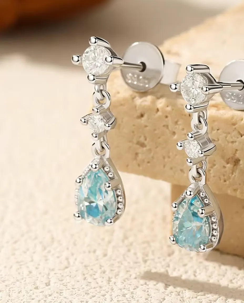 Aqua Blue Moissanite Drop Earrings - 0.50 ct 4 x 6 mm Pear Stone per Earring with Cubic Zirconia Accents, 925 Sterling Silver