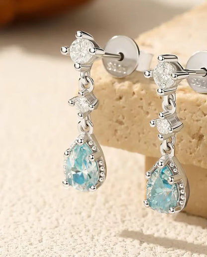Aqua Blue Moissanite Drop Earrings - 0.50 ct 4 x 6 mm Pear Stone per Earring with Cubic Zirconia Accents, 925 Sterling Silver