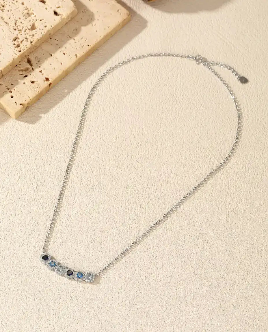 Blue Ombre Bar Necklace - Six Halo Set Blue Stones on a 34 mm Curved Bar, 925 Sterling Silver, 40 + 5 cm