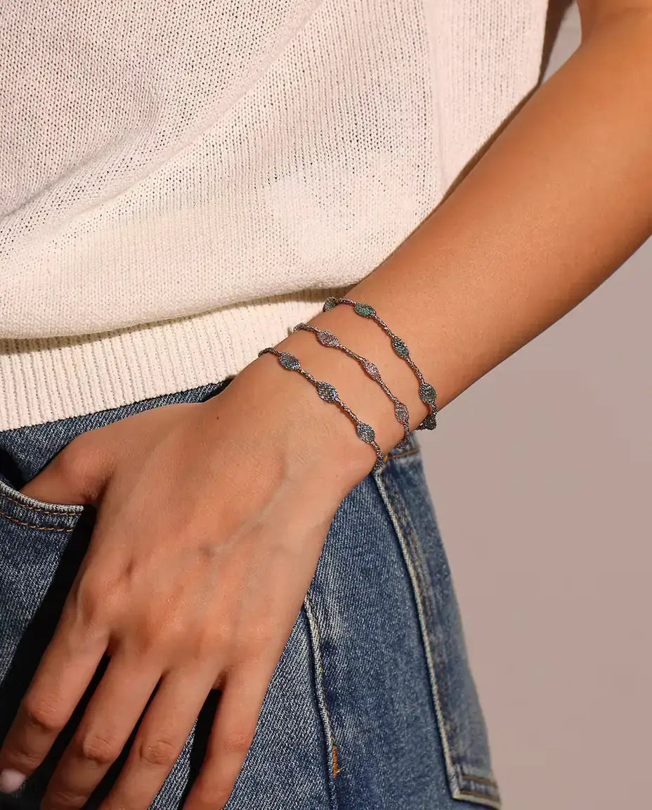 Caged Zircon Bracelet in 925 Sterling Silver - worn on the wrist, stacked with the other two colors