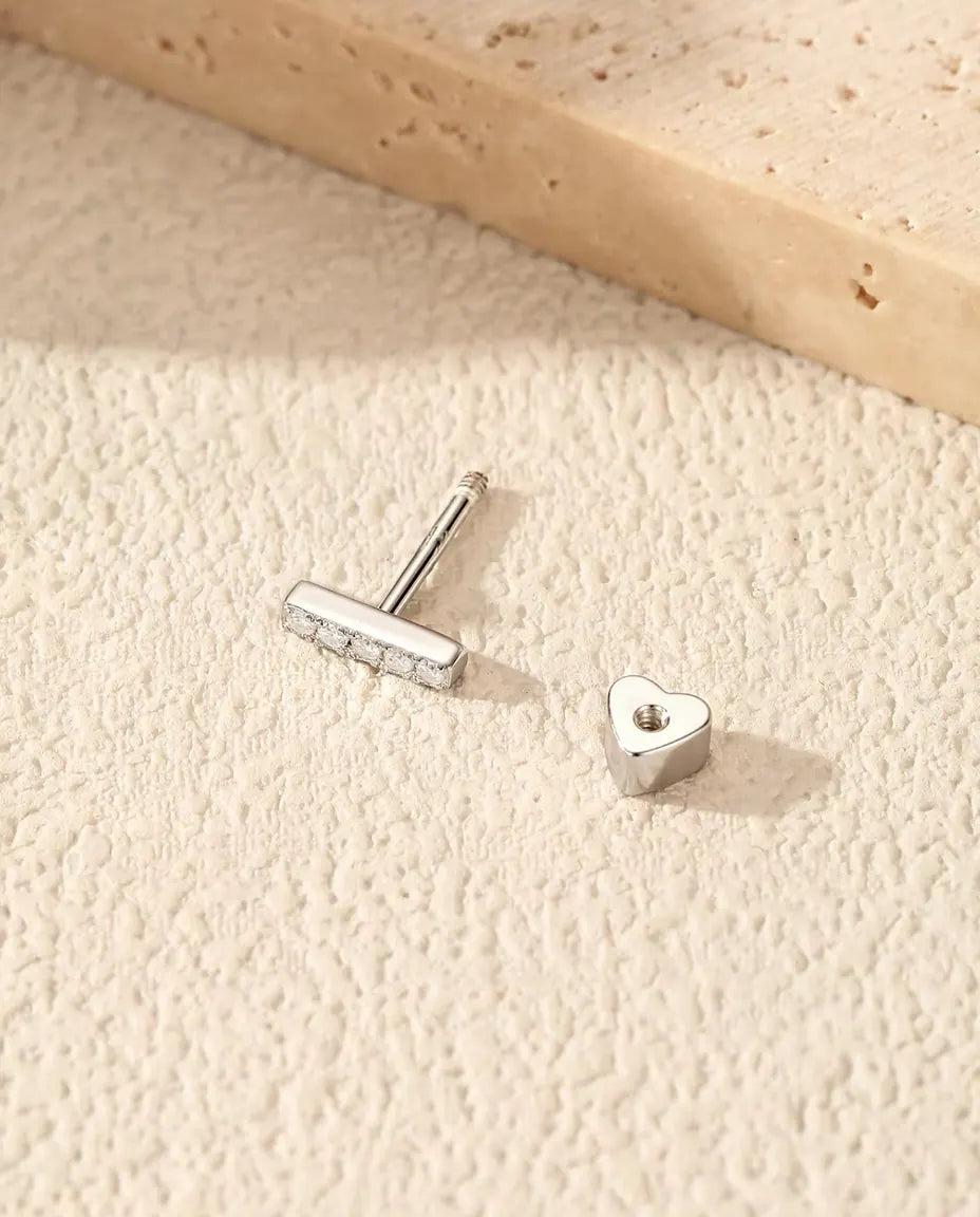 Moissanite Bar Stud Earrings in 925 Sterling Silver - with the heart-shaped back taken off and set beside it