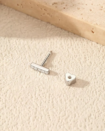 Moissanite Bar Stud Earrings in 925 Sterling Silver - with the heart-shaped back taken off and set beside it