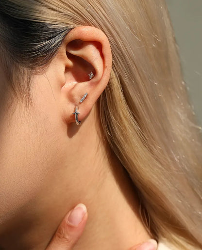 Moissanite Bar Stud Earrings in 925 Sterling Silver - worn in the ear, close-up