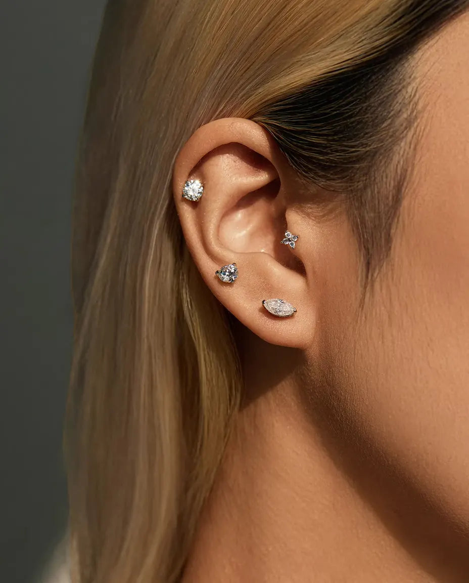 Four-Stone Moissanite Clover Stud Earrings in 925 Sterling Silver - worn in the ear, close-up