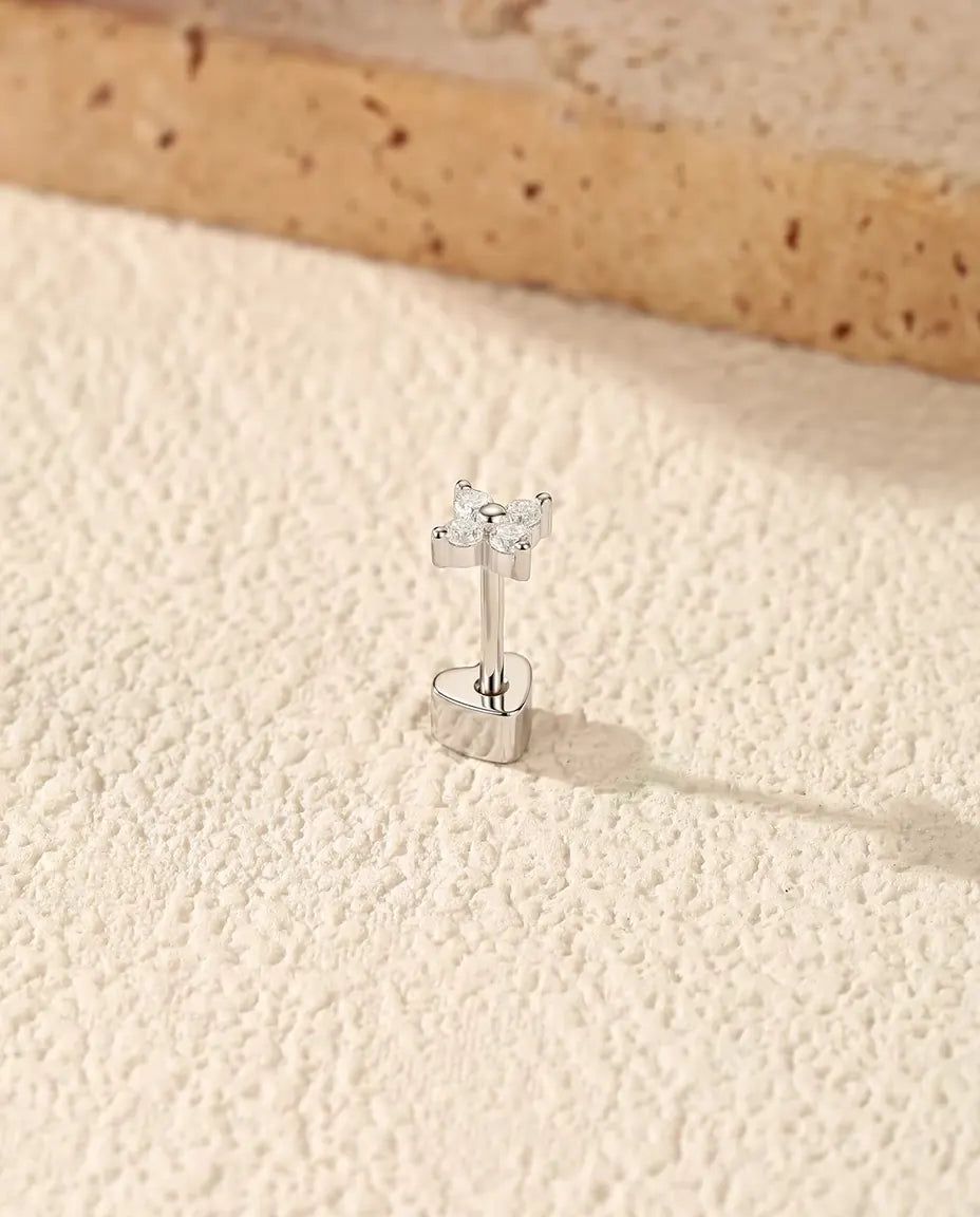 Four-Stone Moissanite Clover Stud Earrings in 925 Sterling Silver - standing on its heart-shaped back, angled view