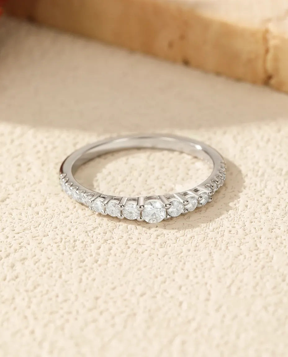 Graduated moissanite wedding band in 925 sterling silver with 19 round D colour stones