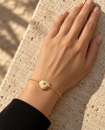 Woman wearing the closed heart photo locket bracelet