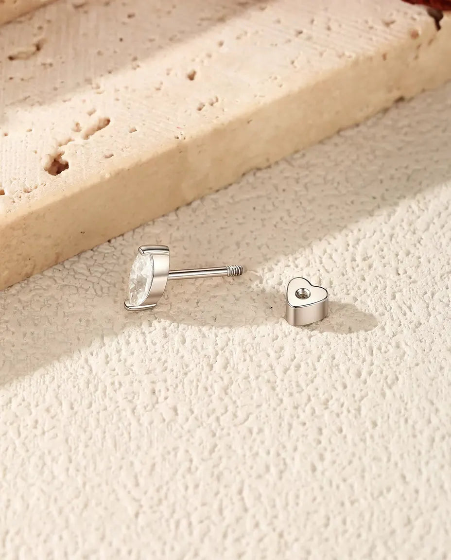 Marquise Moissanite Stud Earrings in 925 Sterling Silver - with the heart-shaped back taken off and set beside it