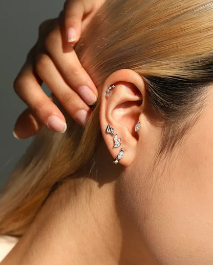 Marquise Moissanite Stud Earrings in 925 Sterling Silver - worn on a model with her hand at the back of her head