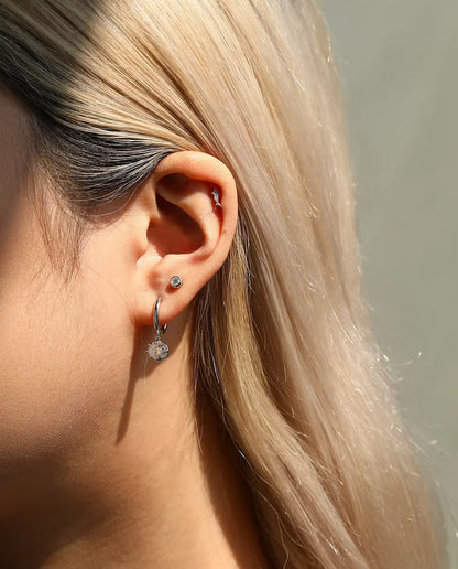 Shark Stud Earrings in 925 Sterling Silver with Moissanite - worn in the ear, close-up