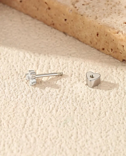 Three-Stone Moissanite Trefoil Stud Earrings in 925 Sterling Silver - front view with the heart-shaped back beside it