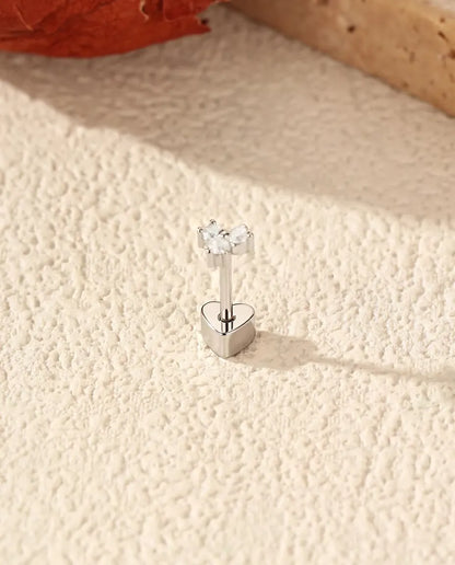 Three-Stone Moissanite Trefoil Stud Earrings in 925 Sterling Silver - standing on its heart-shaped back, angled view