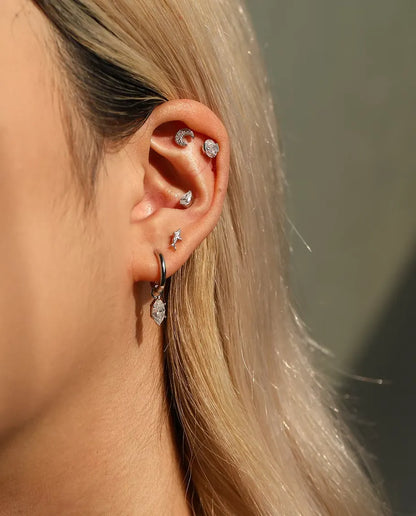 Oval Moissanite Stud Earrings in 925 Sterling Silver - worn together with other studs in the same ear