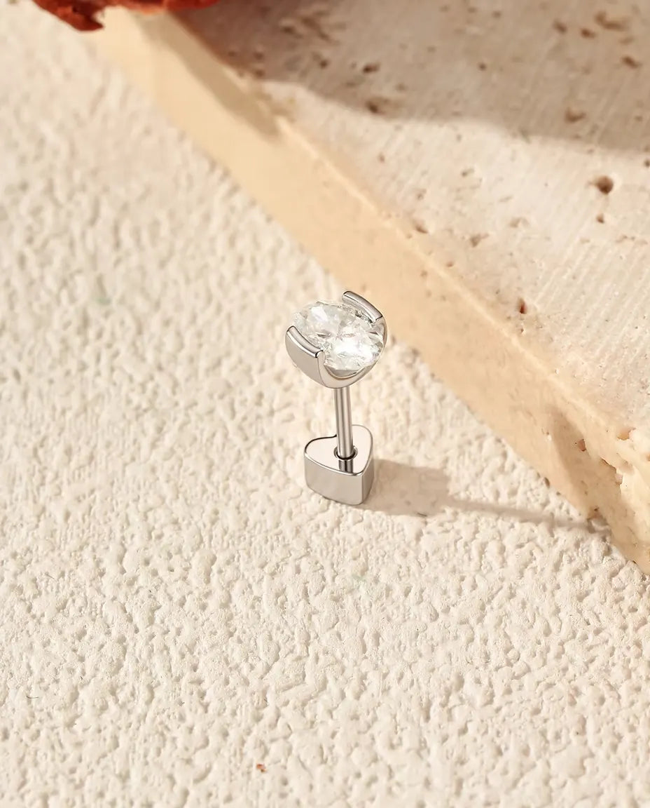 Oval Moissanite Stud Earrings in 925 Sterling Silver - standing on its heart-shaped back, angled view
