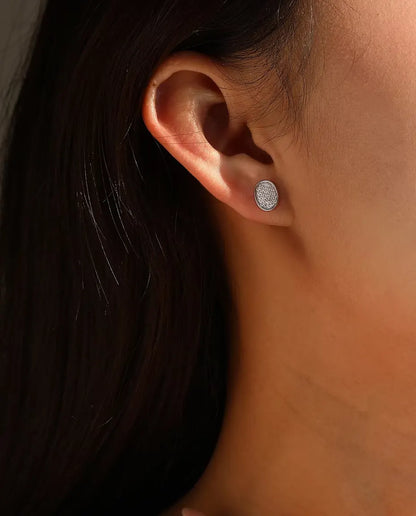 Oval Pave Moissanite Stud Earrings in 925 Sterling Silver - worn in an ear stack, profile view