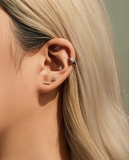 Pear Moissanite Huggie Hoop Earrings in 925 Sterling Silver - worn together with other studs in the same ear