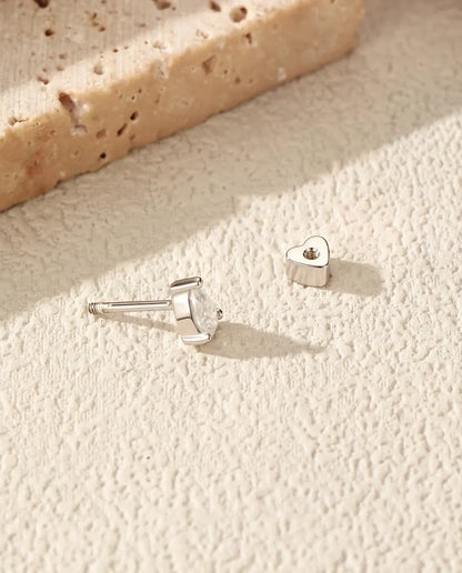 Pear Moissanite Stud Earrings in 925 Sterling Silver - with the heart-shaped back taken off and set beside it