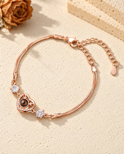 Rose gold tone antler heart bracelet with sparkling side stones and a double box chain