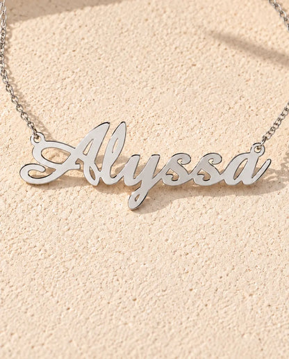 Personalised Script Name Necklace in 925 Sterling Silver - Custom Calligraphy Nameplate - close-up of the cut-out name
