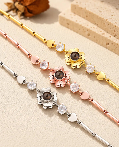 Close-up of three clover flower charms with heart petals in each colour