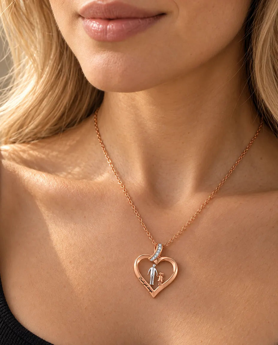 Woman wearing the rose gold tone father daughter heart pendant necklace with a black top