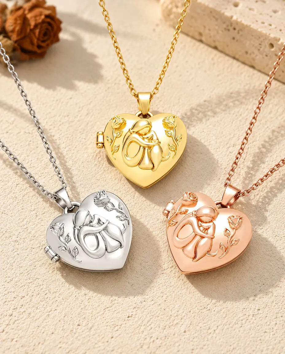Three colours of the dog lover heart photo locket necklace arranged on plaster