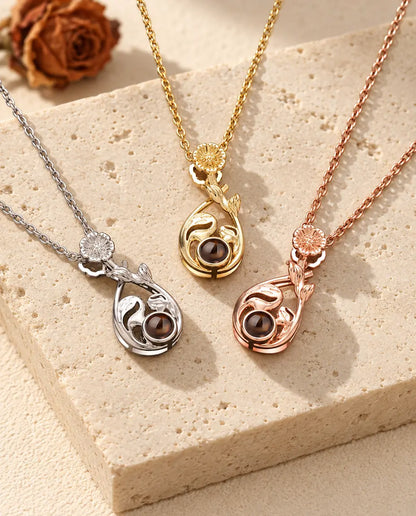 Silver tone, gold tone and rose gold tone teardrop pendants with daisy bails