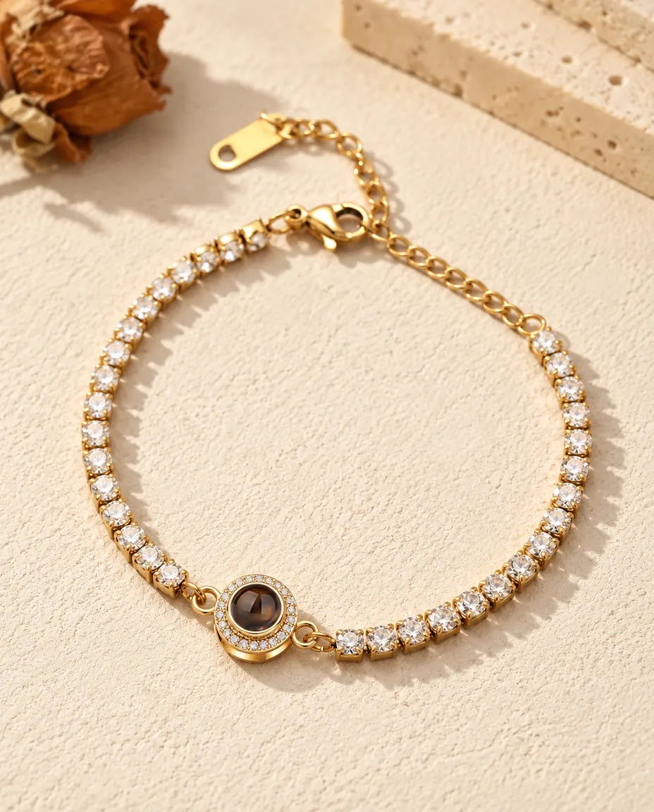 Gold tone halo photo projection tennis bracelet with a full row of cubic zirconia