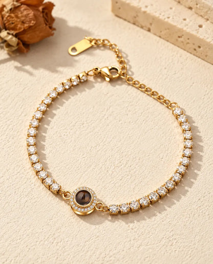 Gold tone halo photo projection tennis bracelet with a full row of cubic zirconia