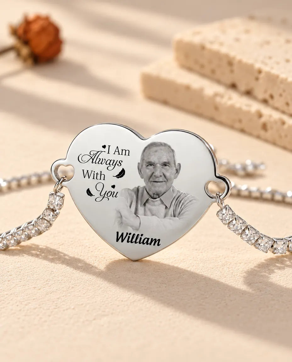 Close-up of the silver heart engraved with a black and white photo, a message and the name William