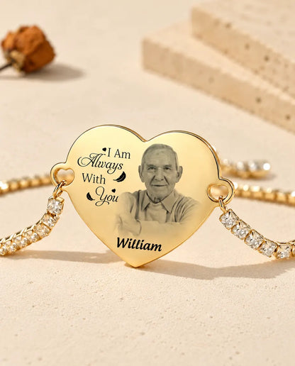 Close-up of the gold tone heart engraved with a photo, a message and a name
