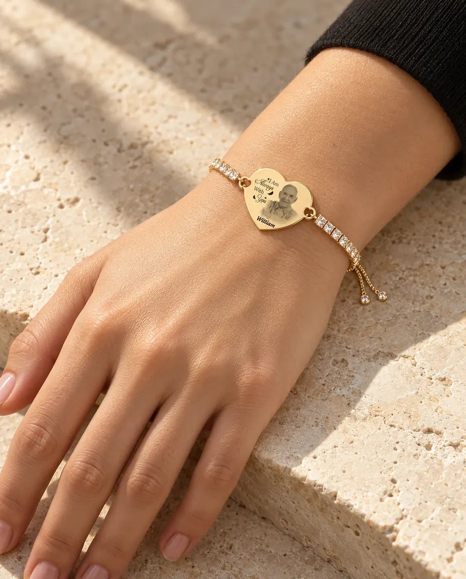 Woman wearing the gold tone engraved photo heart bracelet