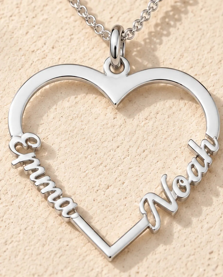 Personalised Heart Name Necklace in 925 Sterling Silver - Open Heart with Two Script Names - close-up of the cut-out name