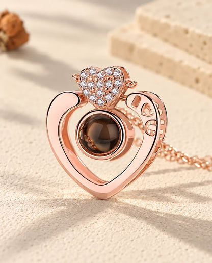 Close-up of the rose gold tone open heart with I heart U cut-outs and a pave heart