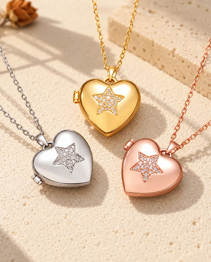 Three colours of the pave star heart photo locket necklace arranged on plaster