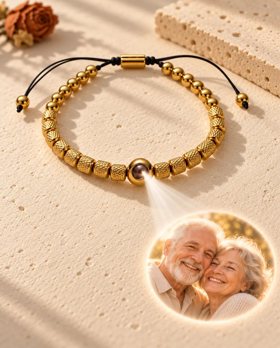 Light through the brown stone of the gold tone bead projects a round photo of an elderly couple