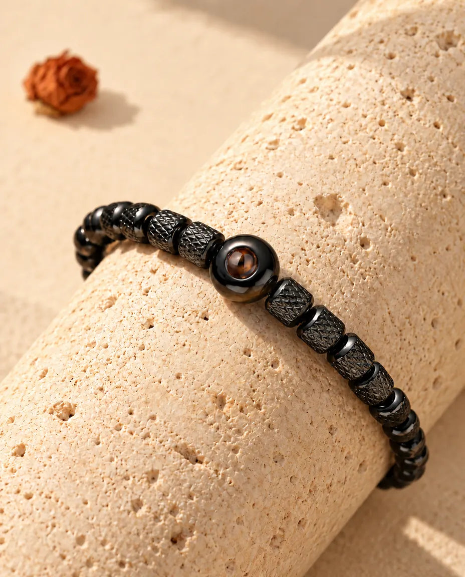 Close-up of the black round projection bead between knurled barrel beads