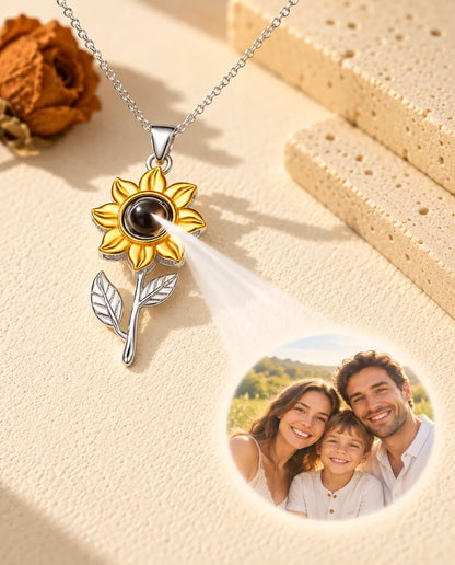 Sunflower necklace projecting a family photo onto cream plaster