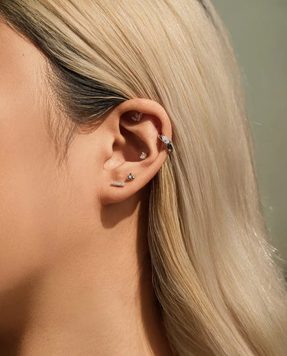 Round Moissanite Stud Earrings in 925 Sterling Silver - worn in the ear, close-up
