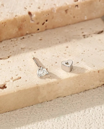 Round Moissanite Stud Earrings in 925 Sterling Silver - with the heart-shaped back taken off and set beside it