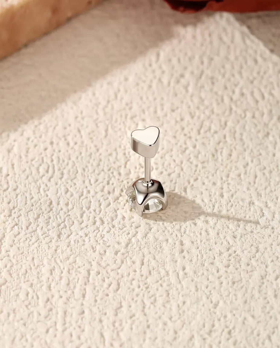 Round Moissanite Four-Prong Stud Earrings in 925 Sterling Silver - standing with the heart-shaped back on top, seen from behind