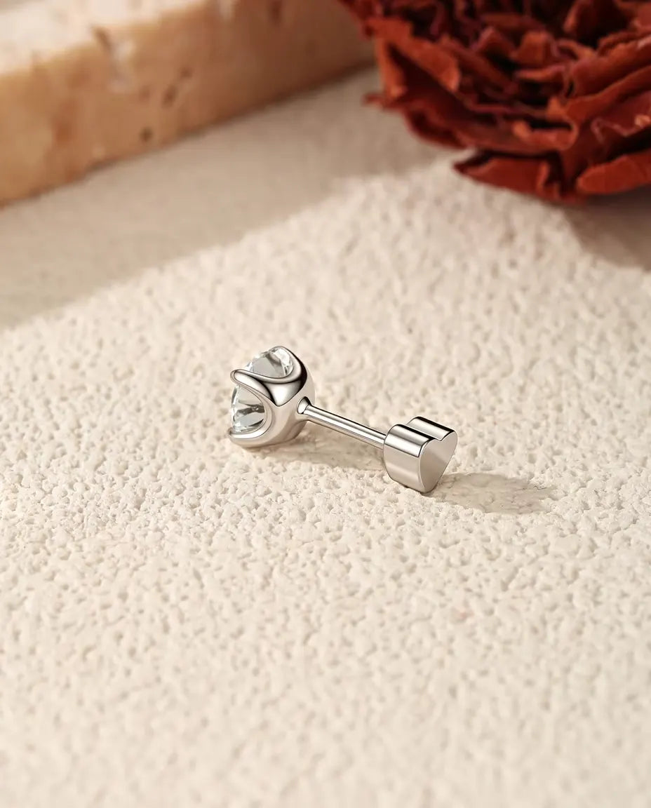 Round Moissanite Four-Prong Stud Earrings in 925 Sterling Silver - side view showing the post and heart-shaped back