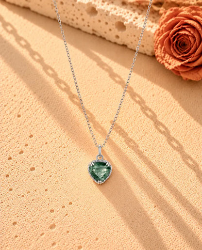 Heart Moss Agate Pendant Necklace in 925 Sterling Silver - the whole necklace laid out in a long V on a cream textured surface