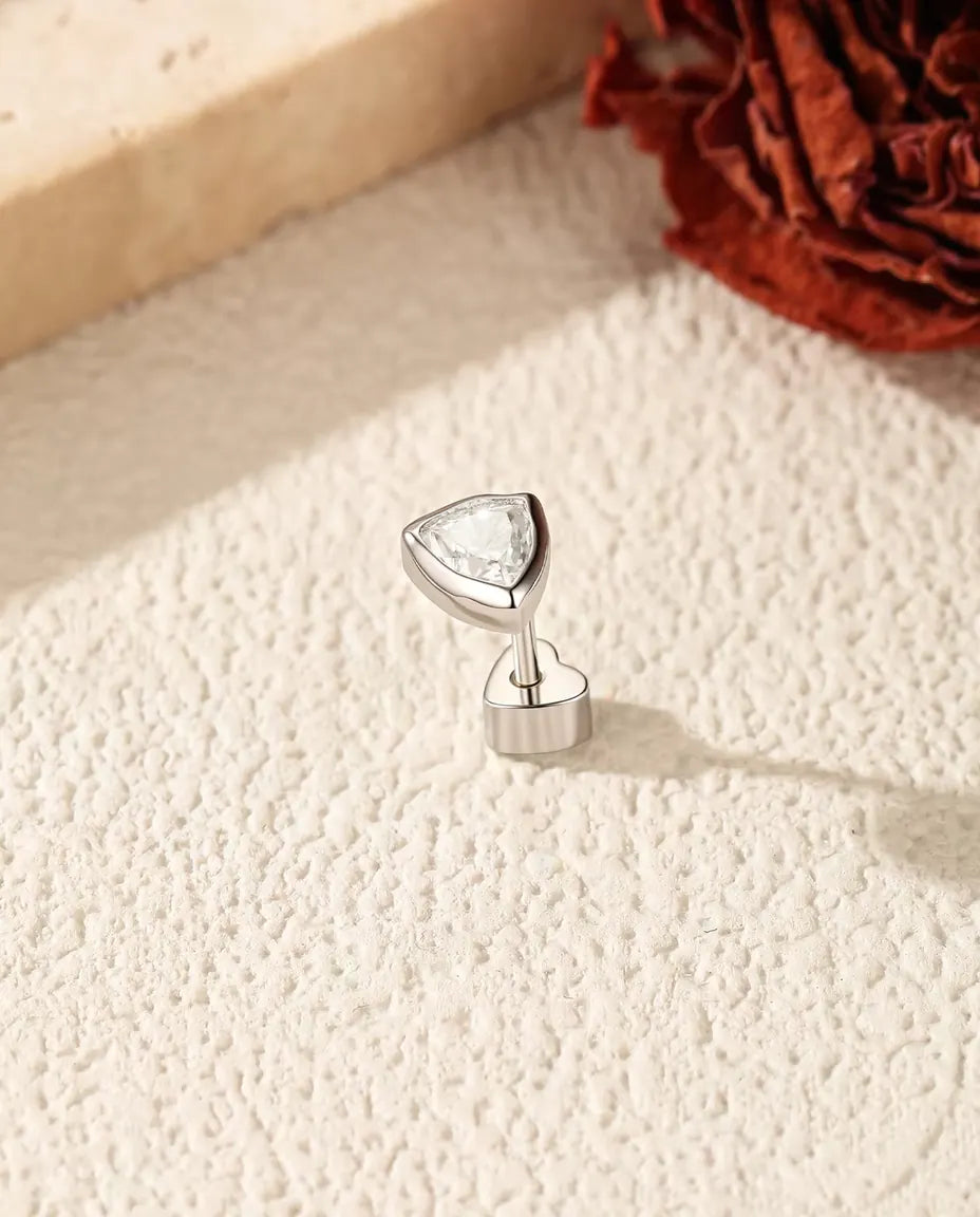 Trillion Moissanite Bezel Stud Earrings in 925 Sterling Silver - standing on its heart-shaped back, angled view