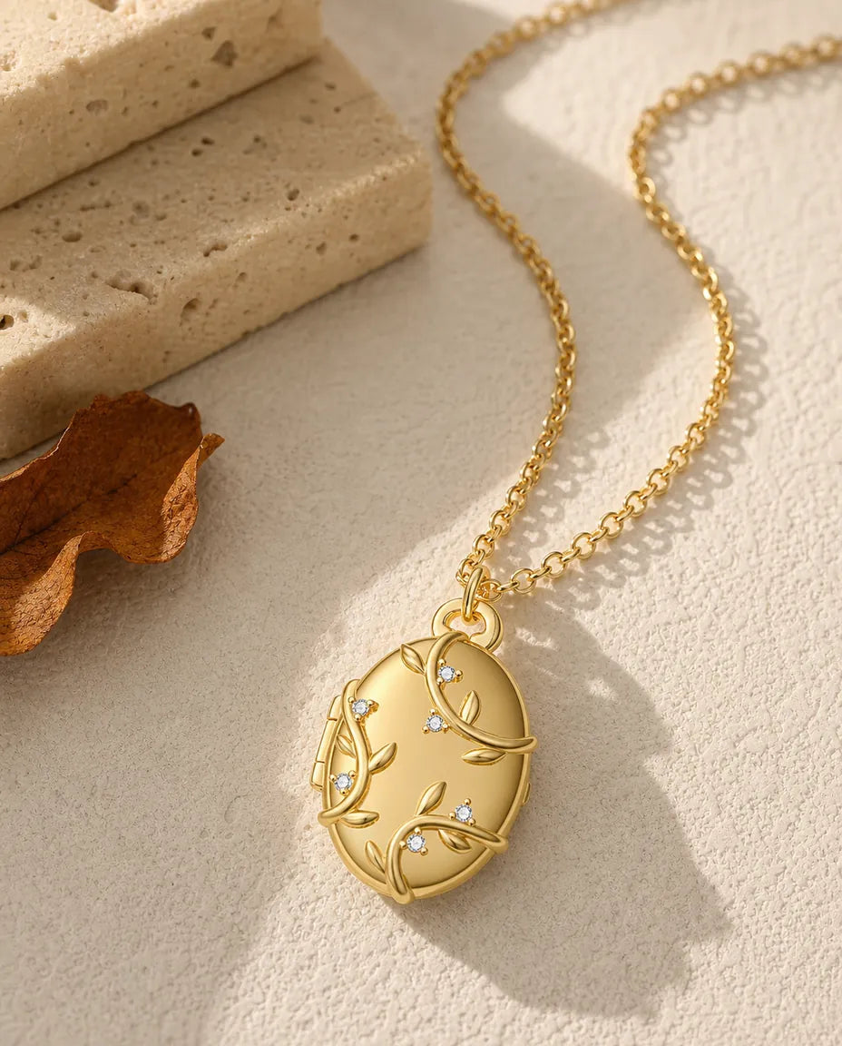 Personalised vine and crystal oval photo locket necklace holding two pictures, gold