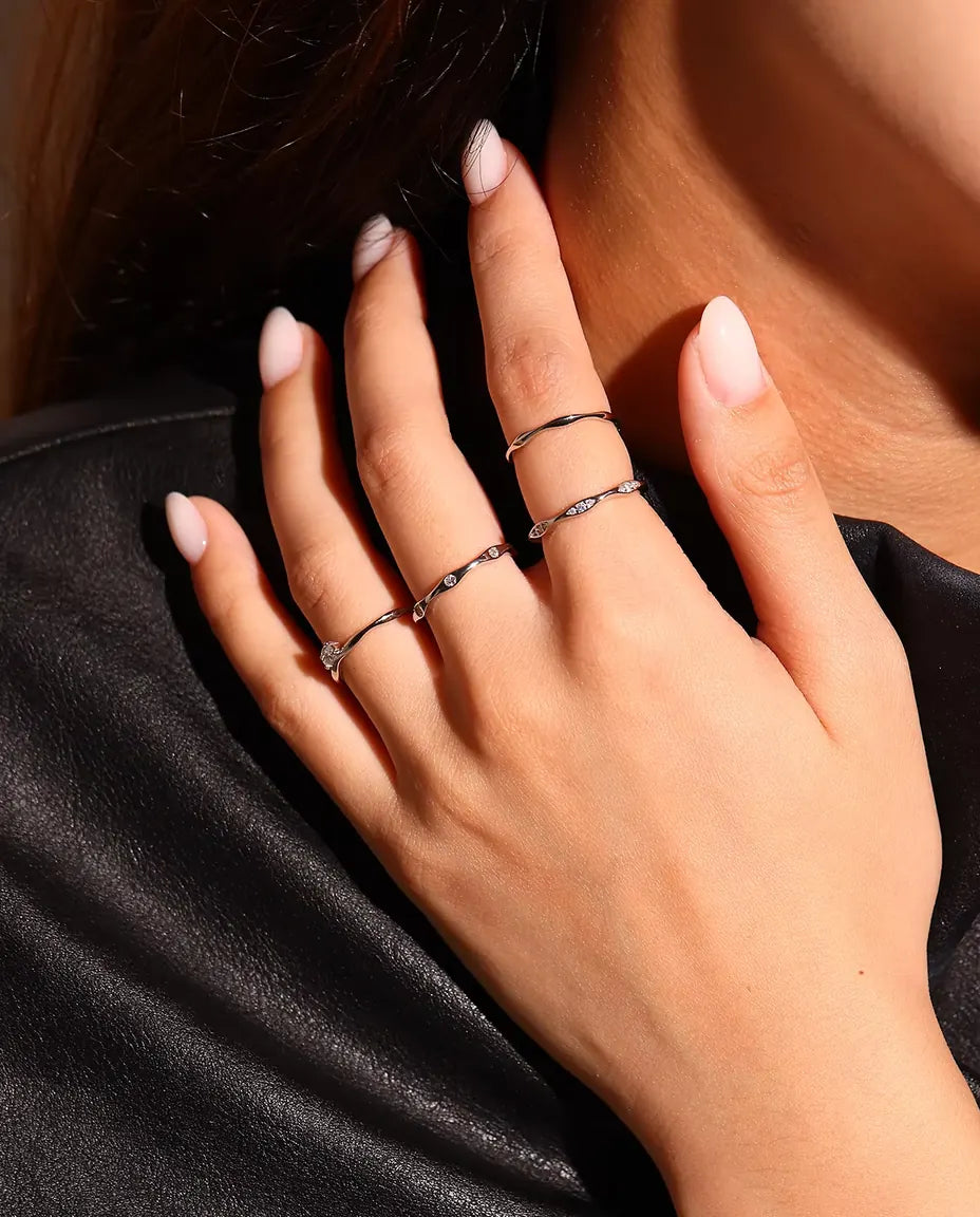 Wavy Moissanite Band Ring in 925 Sterling Silver - worn on a hand resting on the shoulder